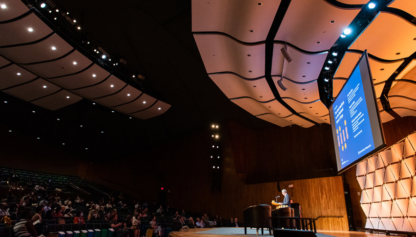 Speaker on stage at MIT's Kresge Hall